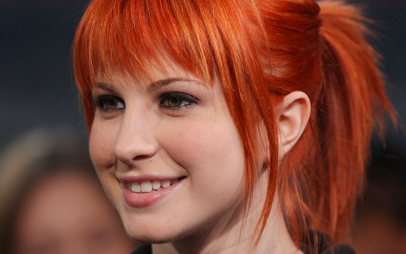 woman with red hair smiling