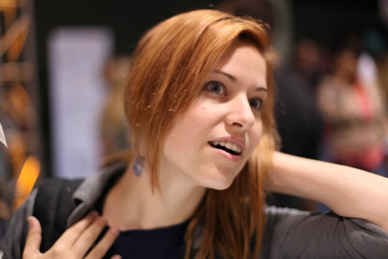 woman with red hair smiling