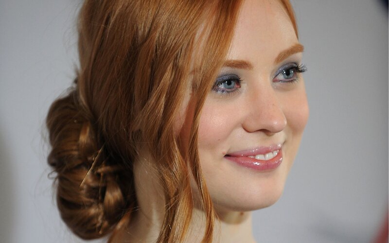 woman with red hair smiling