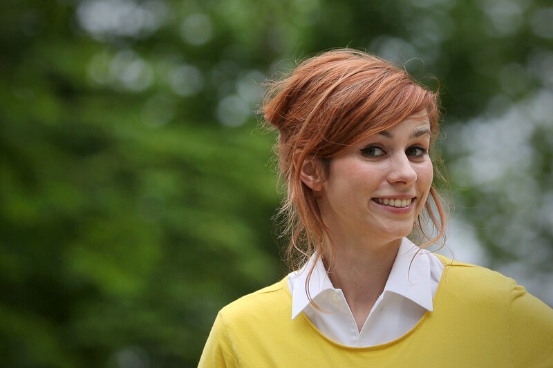 woman with red hair smiling