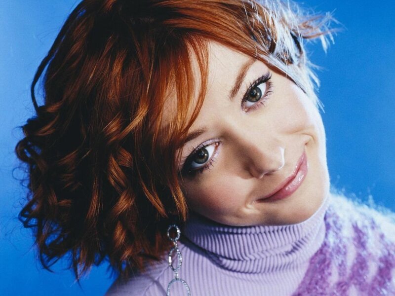 woman with red hair smiling