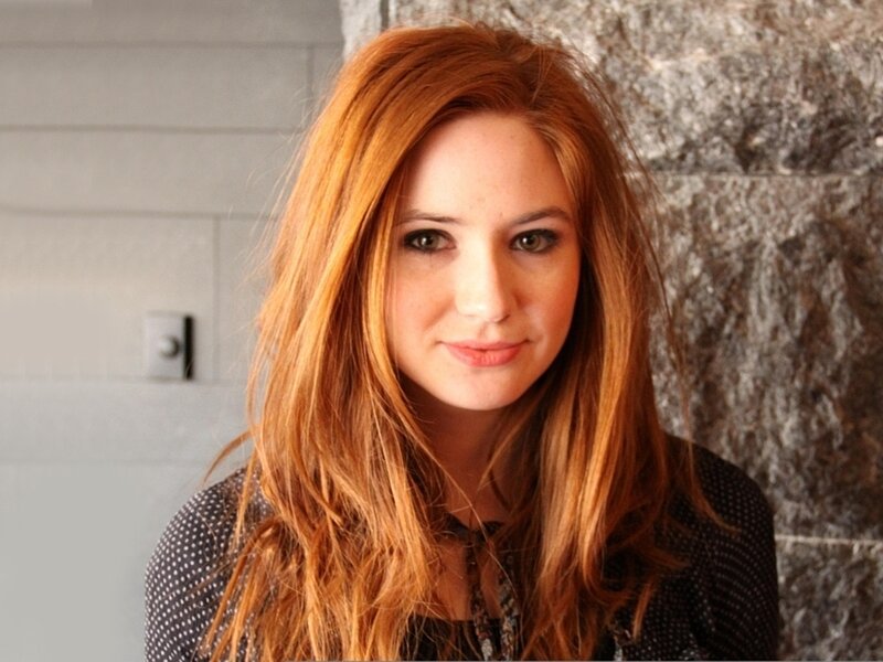 woman with red hair smiling