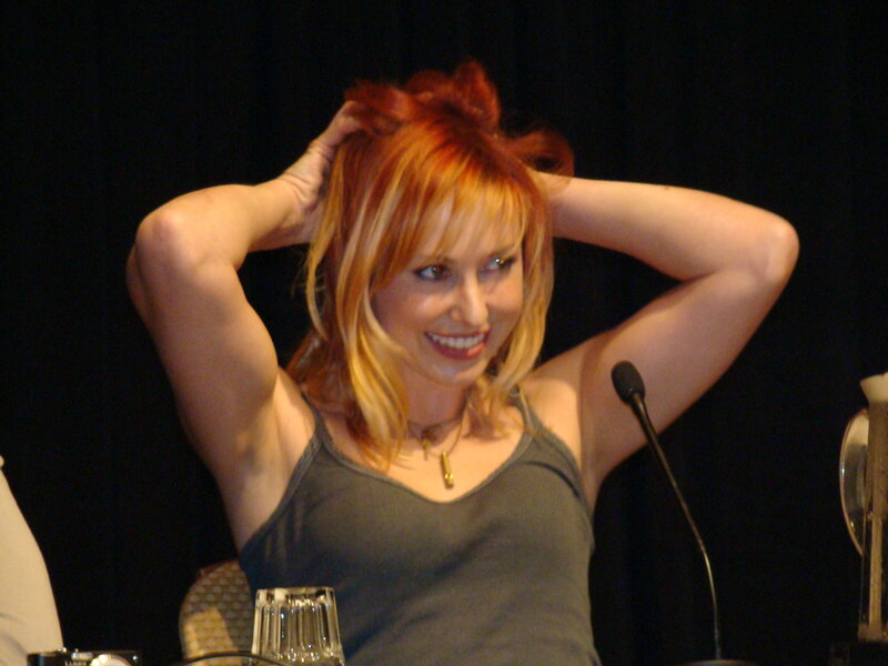 woman with red hair smiling