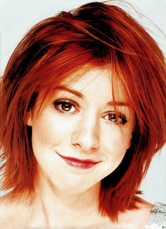 woman with red hair smiling