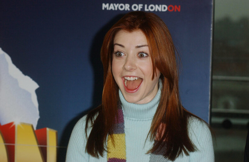 woman with red hair smiling