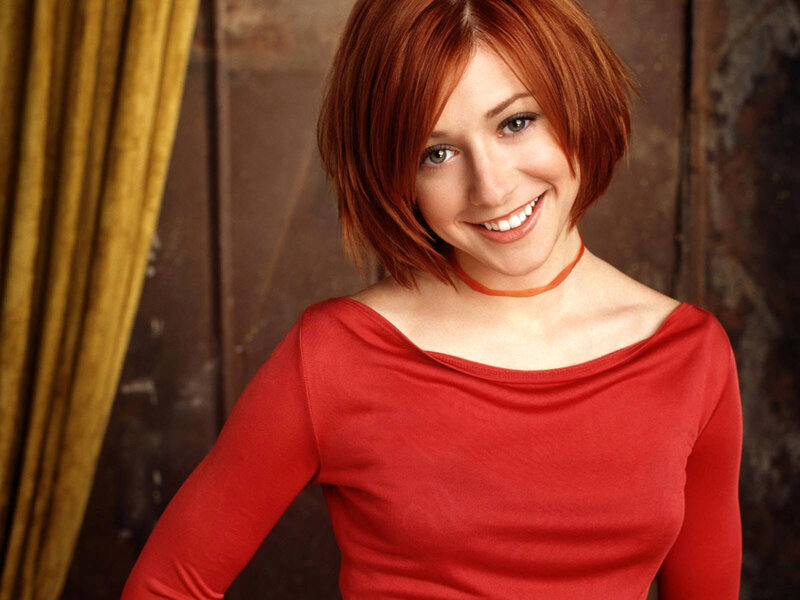 woman with red hair smiling