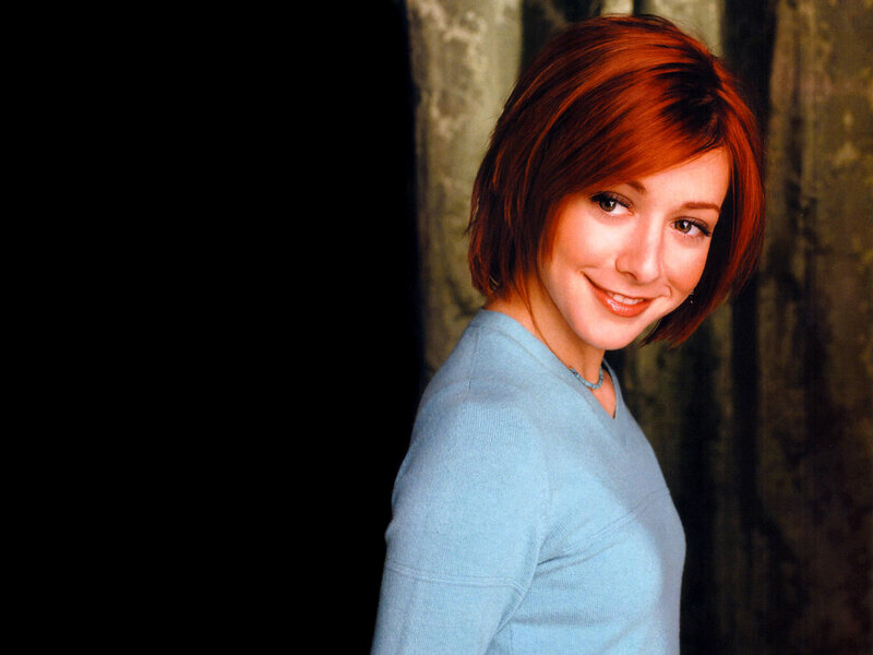 woman with red hair smiling