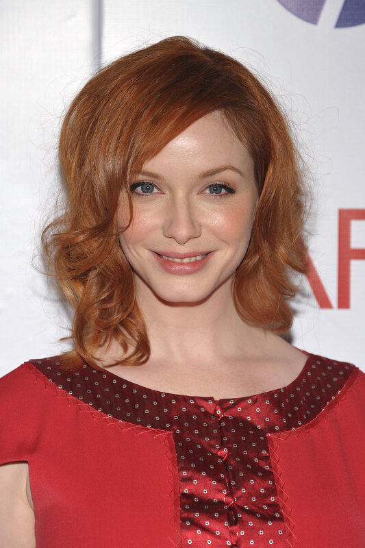 woman with red hair smiling