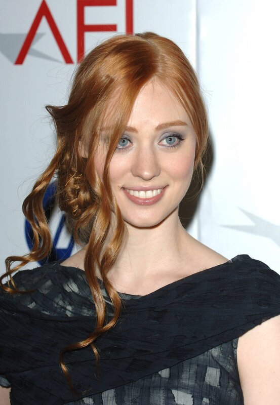 woman with red hair smiling