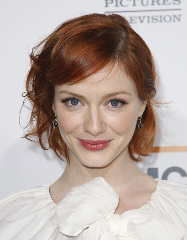 woman with red hair smiling