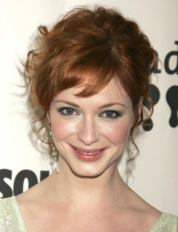 woman with red hair smiling