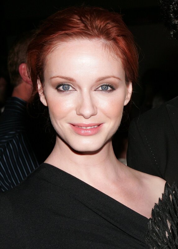 woman with red hair smiling