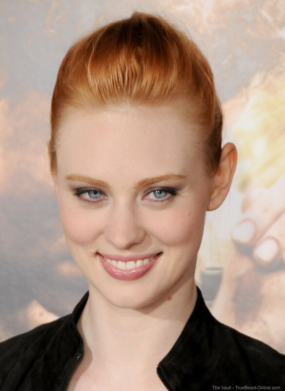 woman with red hair smiling
