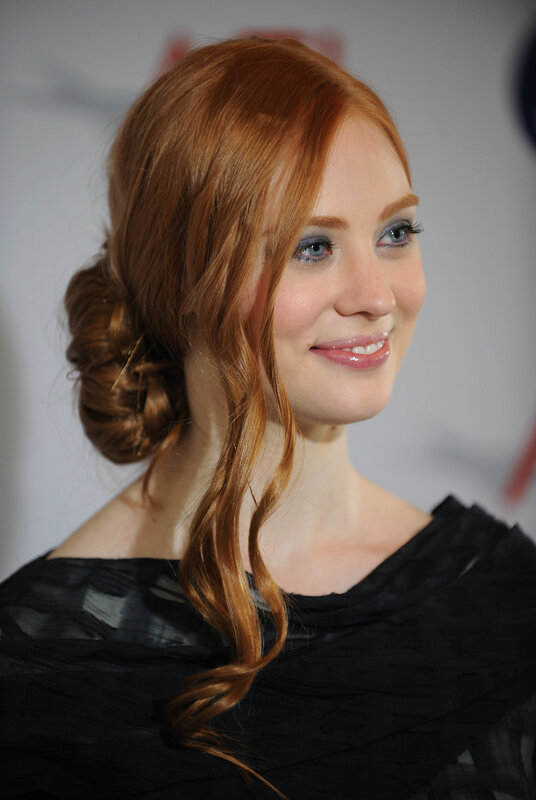 woman with red hair smiling