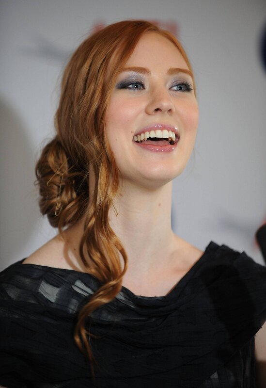 woman with red hair smiling