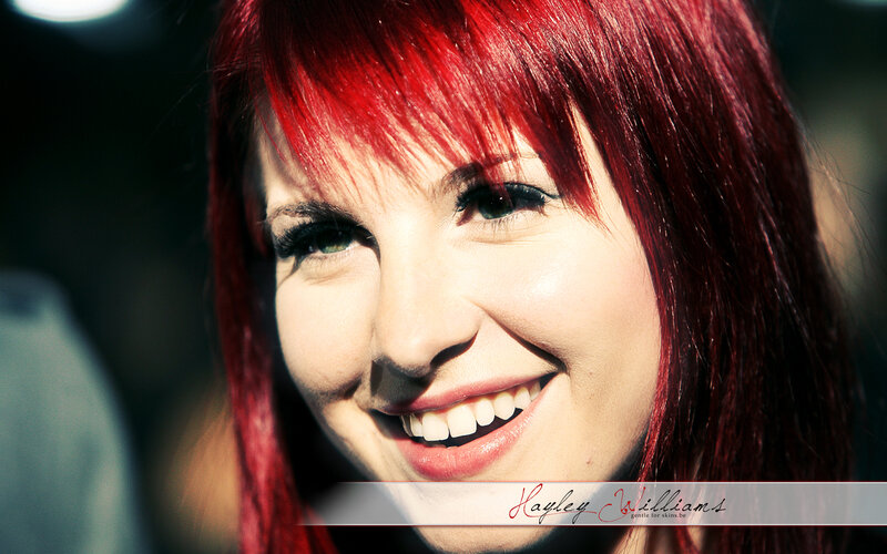 woman with red hair smiling