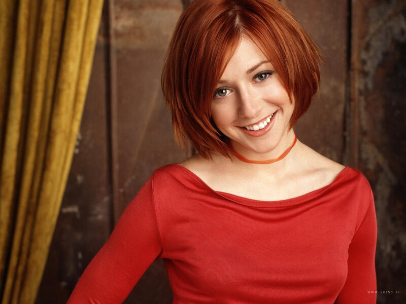 woman with red hair smiling