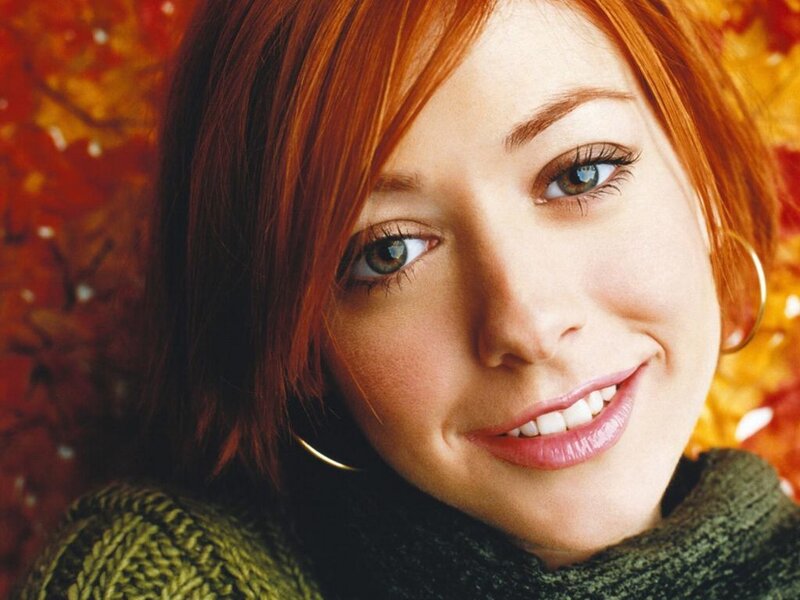 woman with red hair smiling