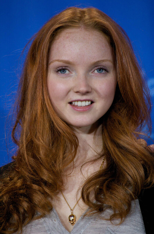 woman with red hair smiling