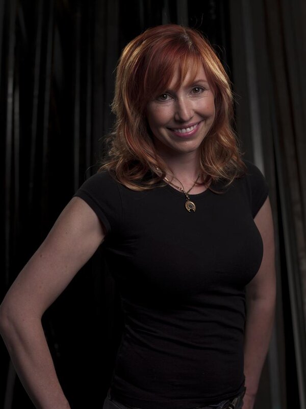 woman with red hair smiling