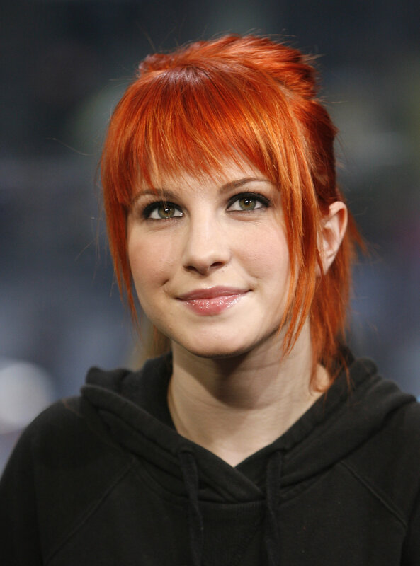 woman with red hair smiling