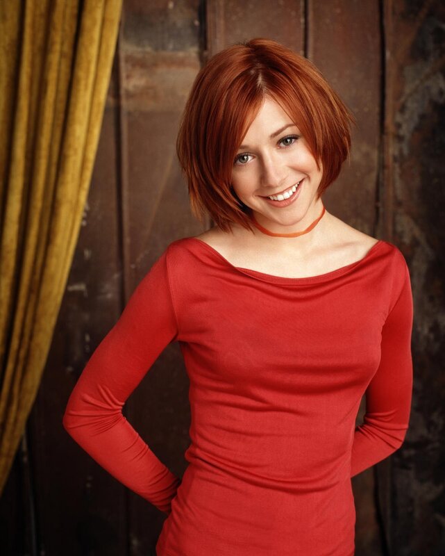 woman with red hair smiling