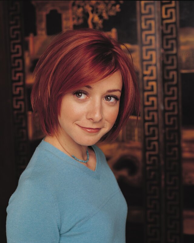 woman with red hair smiling