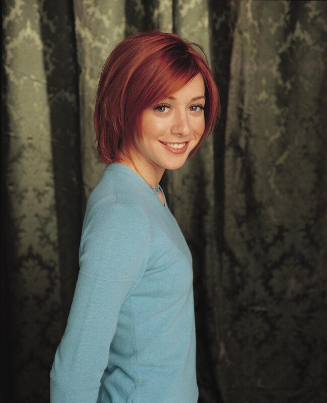 woman with red hair smiling