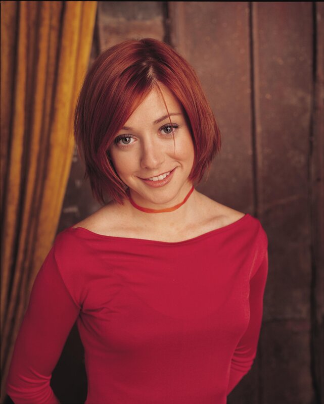 woman with red hair smiling