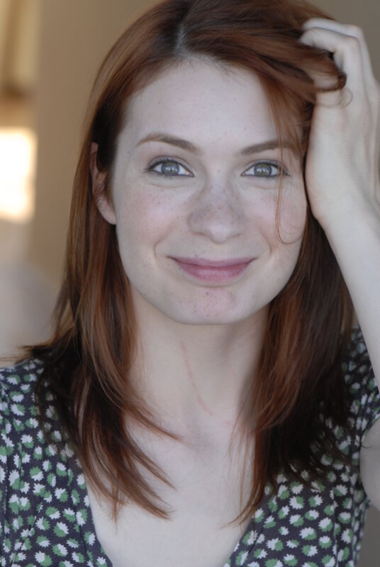 woman with red hair smiling