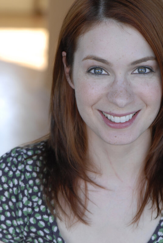 woman with red hair smiling