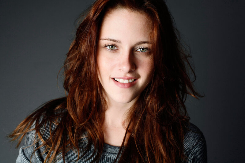 woman with red hair smiling