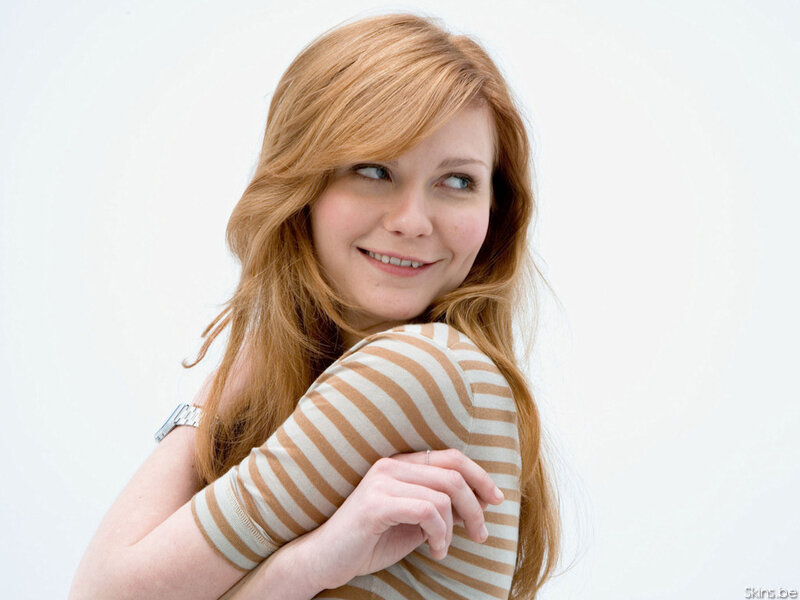 woman with red hair smiling