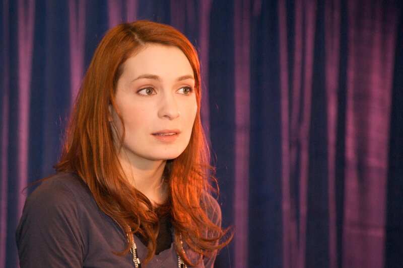 woman with red hair speaking