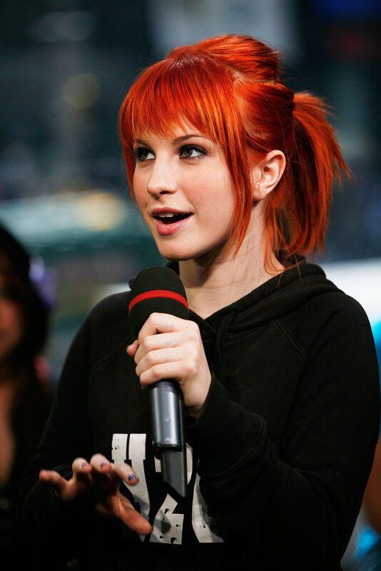woman with red hair speaking
