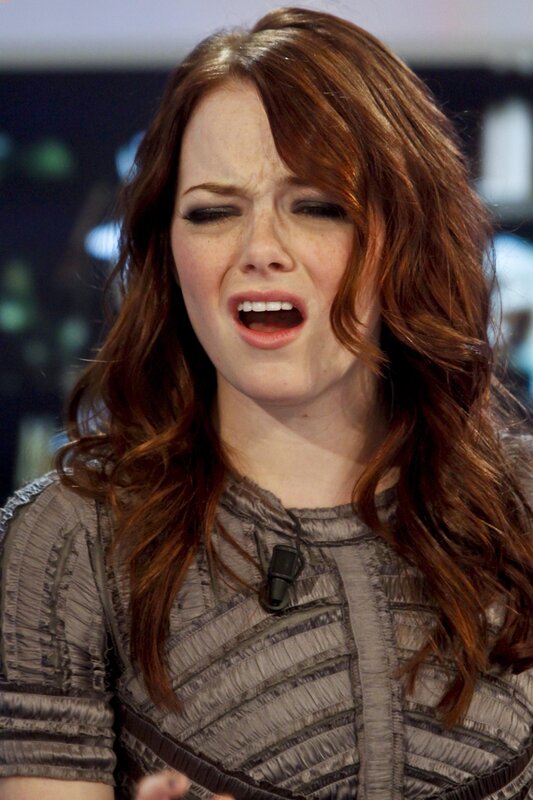 woman with red hair speaking
