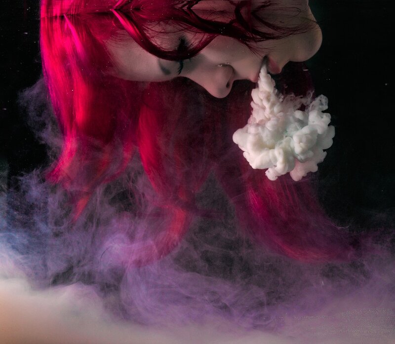 woman with red hair underwater