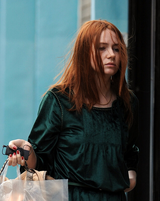 woman with red hair walking