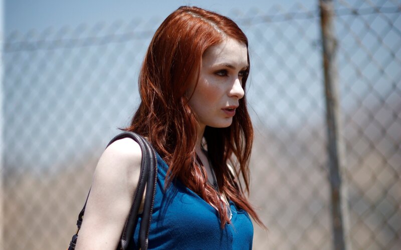 woman with red hair walking