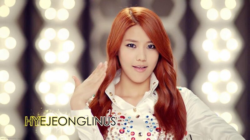 woman with red hair waving