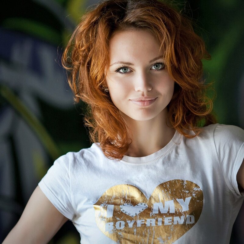 woman with red hair wearing t-shirt