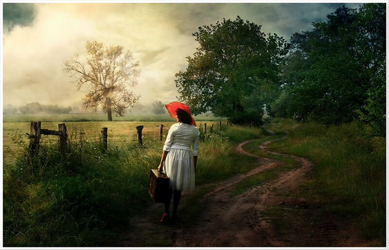 Woman with red hat on a country path