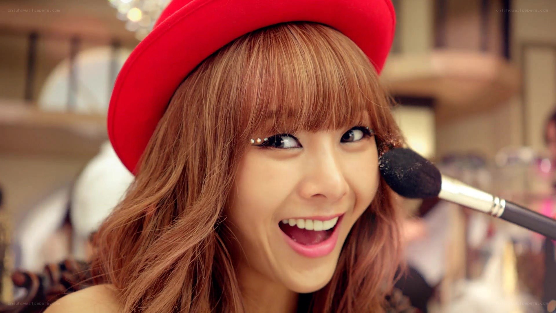 woman with red hat smiling