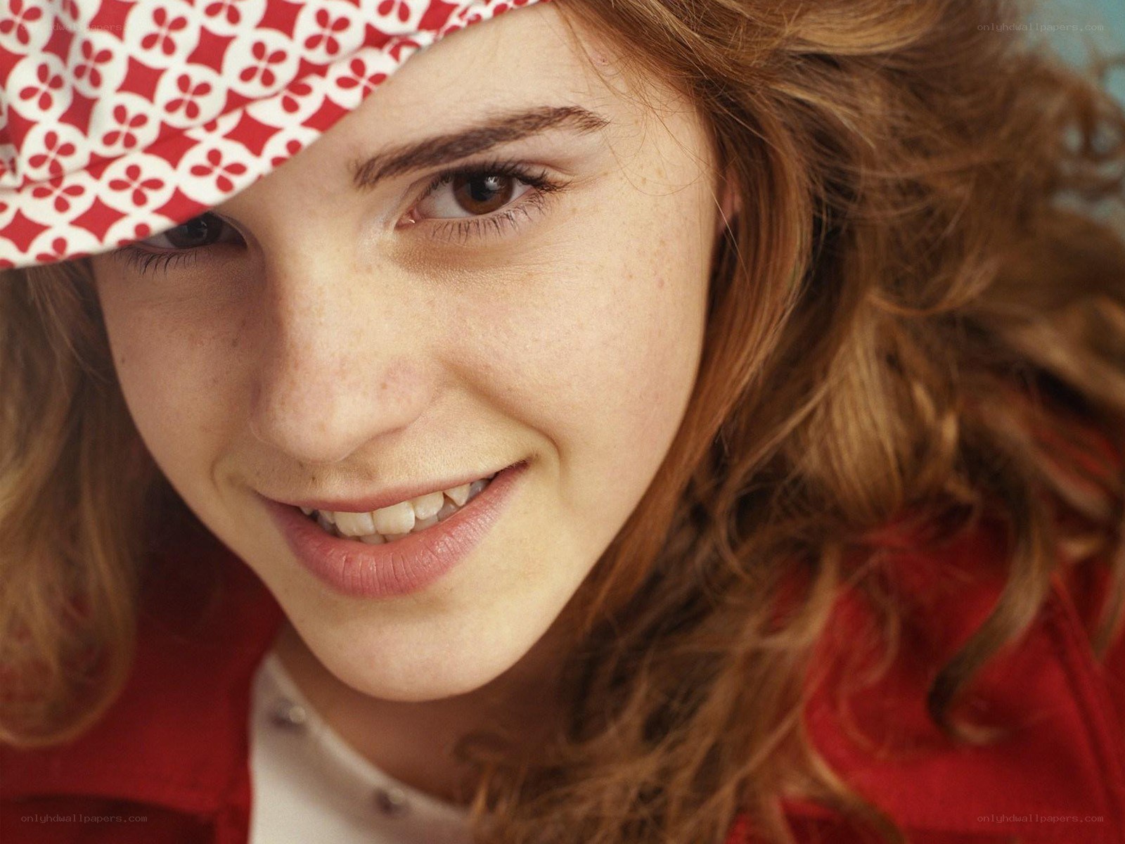 woman with red hat smiling