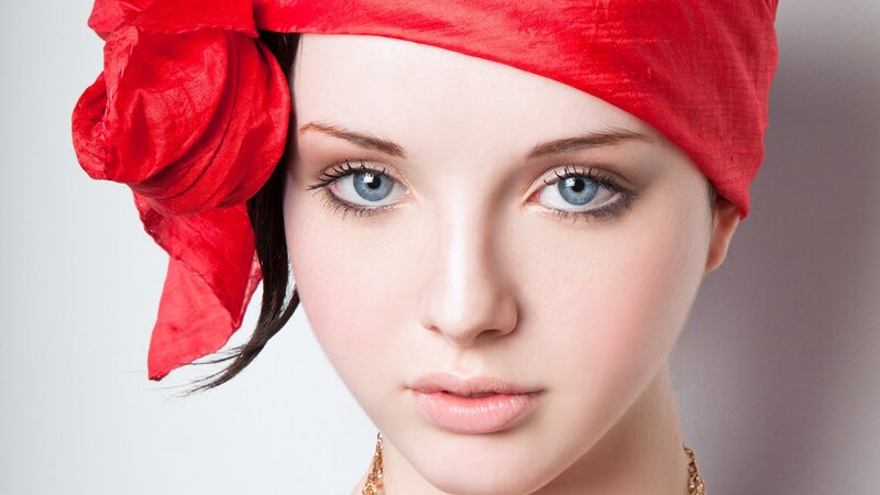 woman with red headscarf