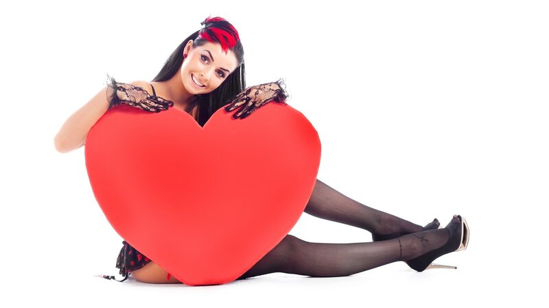 woman with red heart pillow