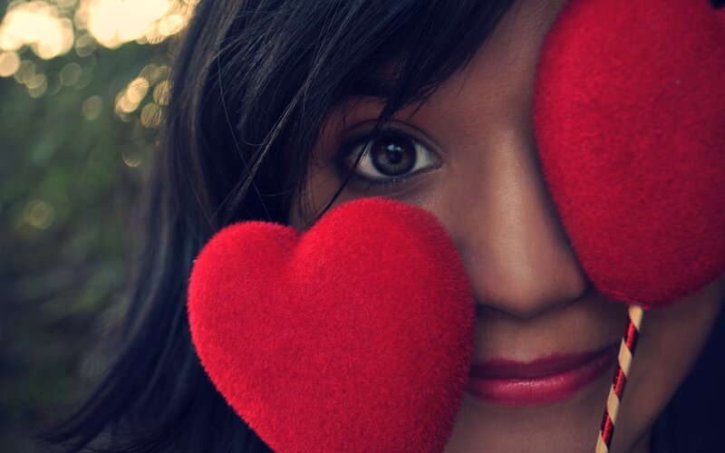 woman with red heart props