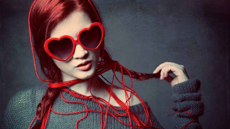 woman with red heart sunglasses