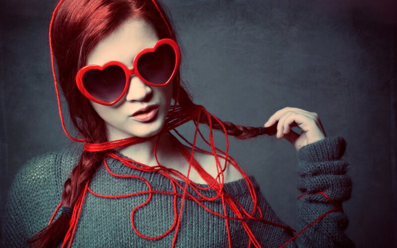 Woman with red heart sunglasses