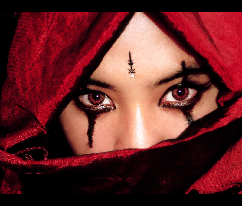 woman with red hood and makeup